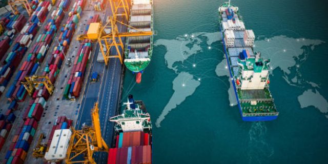 Aerial top view containers ship cargo business commercial trade logistic and transportation of international import export by container freight cargo ship with on worldmap